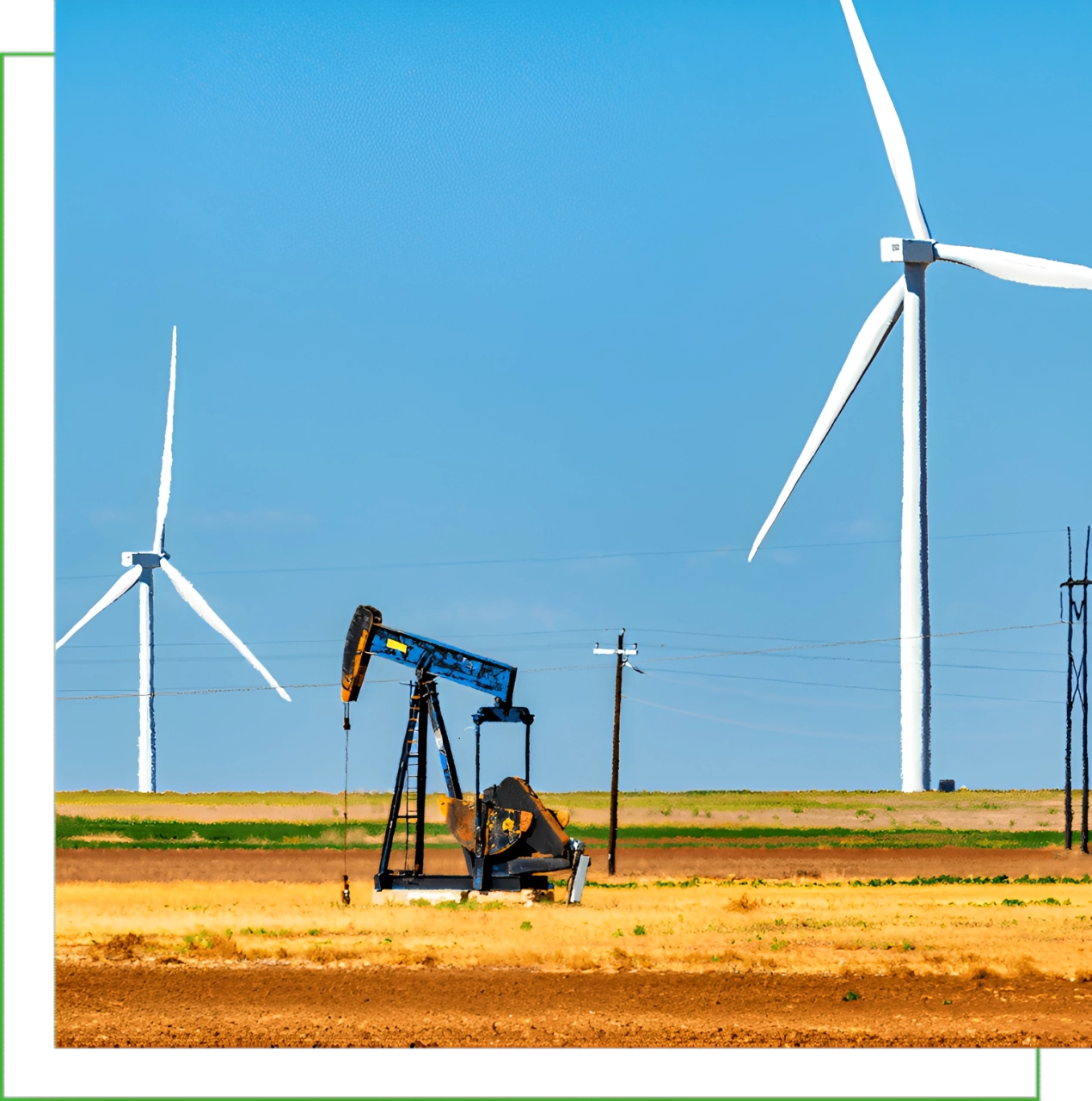 Wind turbines beside oil pump in landscape